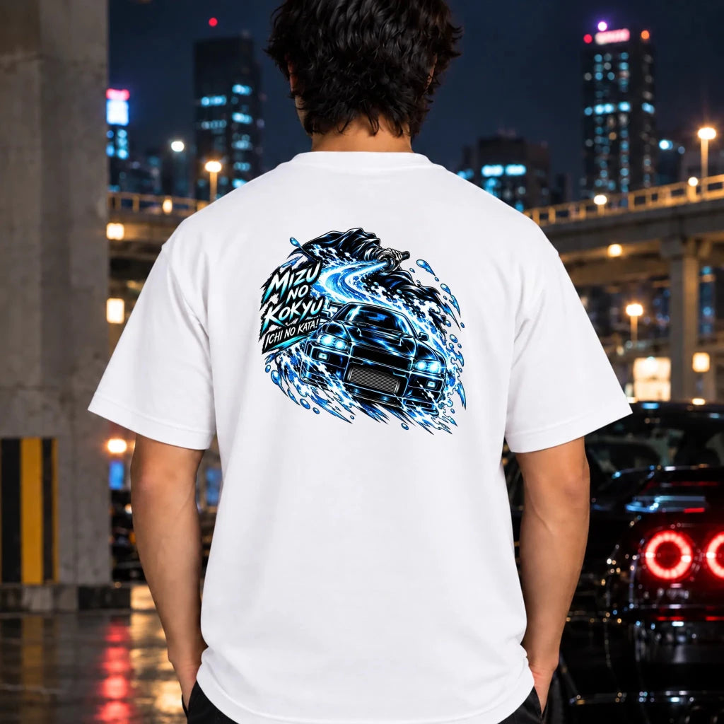 man wearing a white t-shirt showing the back graphic with a car and the text "ichi no kata!"