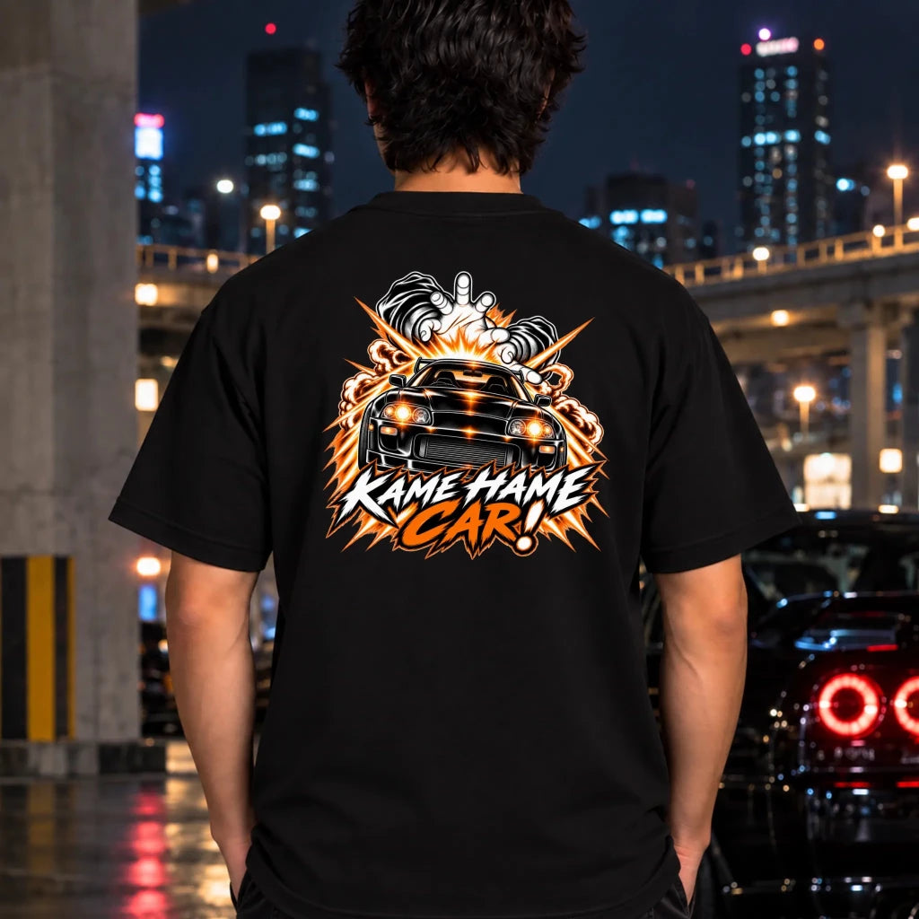 man wearing a black t-shirt featuring a large graphic print on the back of a black car with blue lightning effects and the text 'KAME HAME CAR!'.