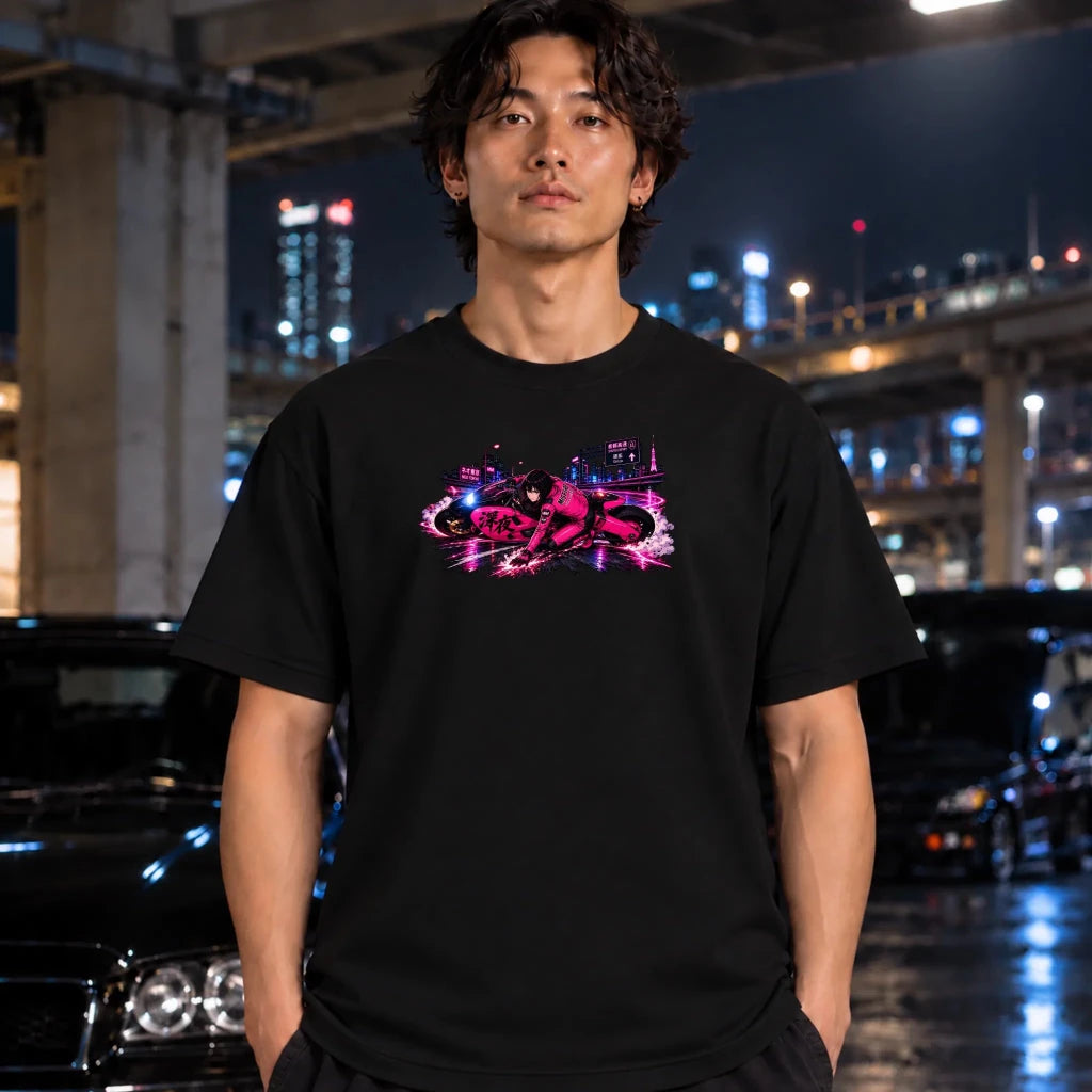 black short-sleeve t-shirt with a vibrant pink and purple neon-style graphic of a motorcycle and city scene on the chest, worn by a man standing under the bridge