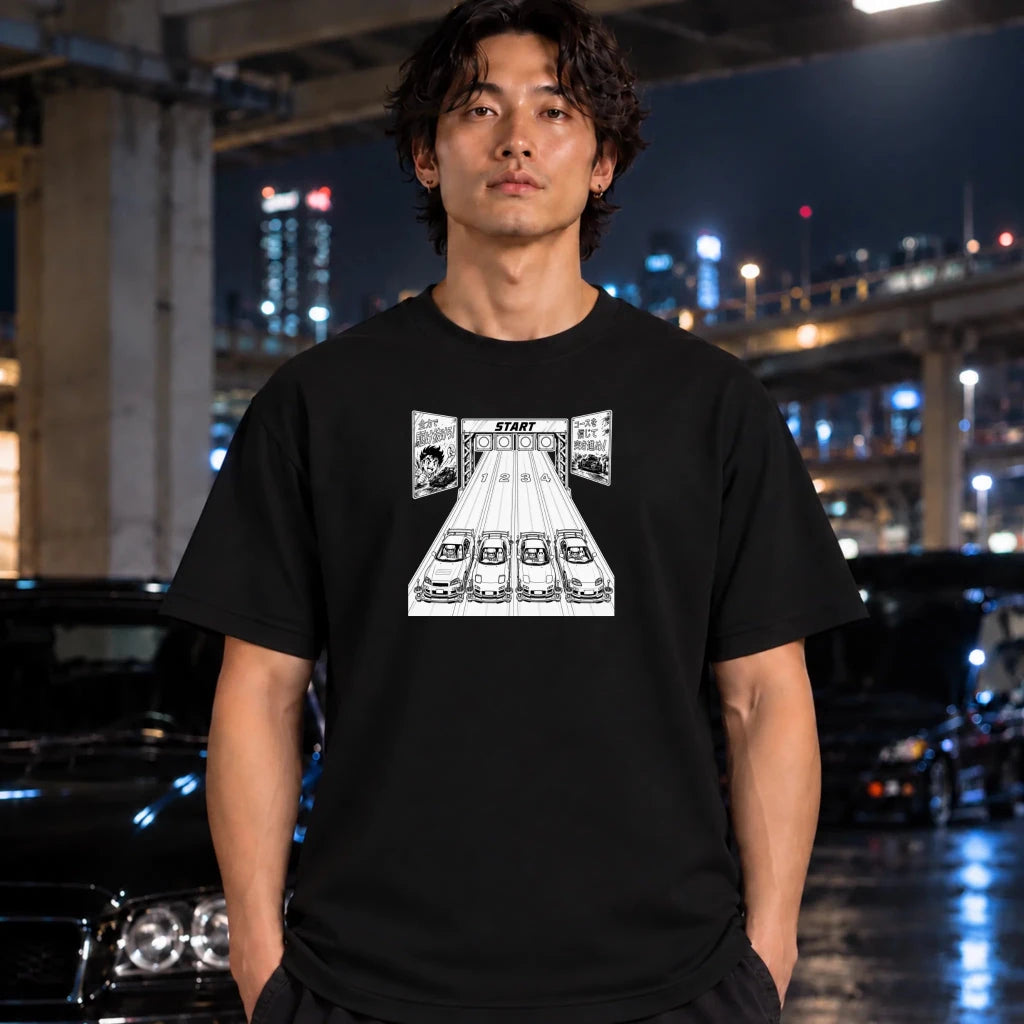 A man wearing a black graphic t-shirt with a white manga-style illustration of a starting line , standing in a wet urban night scene with cars and city lights in the background.