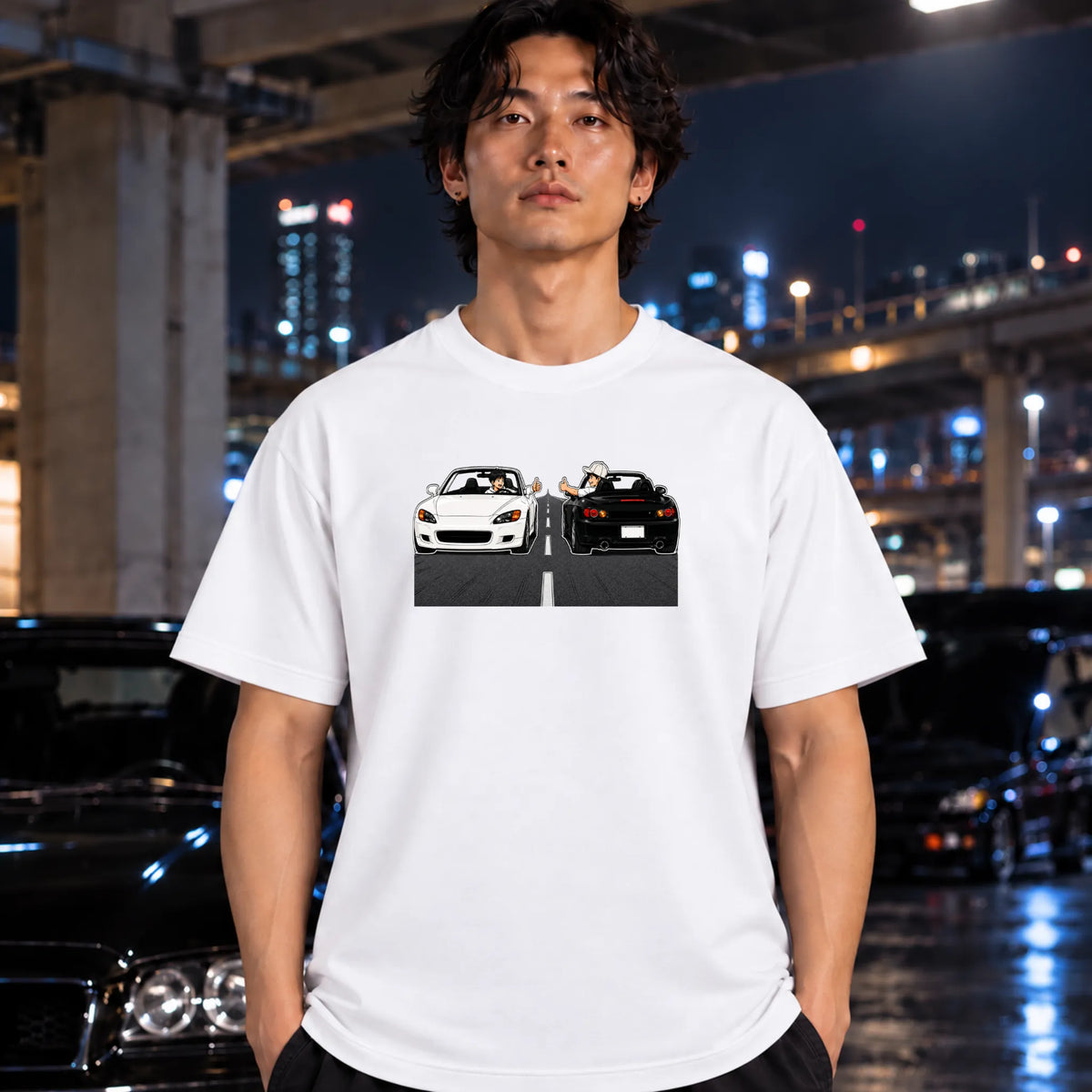 man wearing a white t-shirt featuring a graphic print of a white convertible sports car facing a black sports car in a split scene.