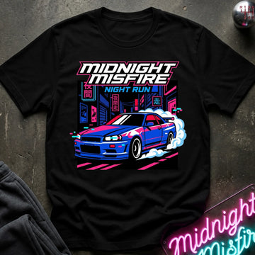 A black short-sleeve graphic T-shirt laid flat on a dark textured surface. The shirt features a colorful neon-style print of a blue sports car with pink and white smoke, plus the text 'MIDNIGHT MISFIRE' and 'NIGHT RUN'.