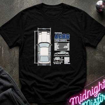 A black short-sleeve graphic t-shirt laid flat on a dark textured surface. The shirt features a white and blue schematic-style print of a car with dimensions and technical details.