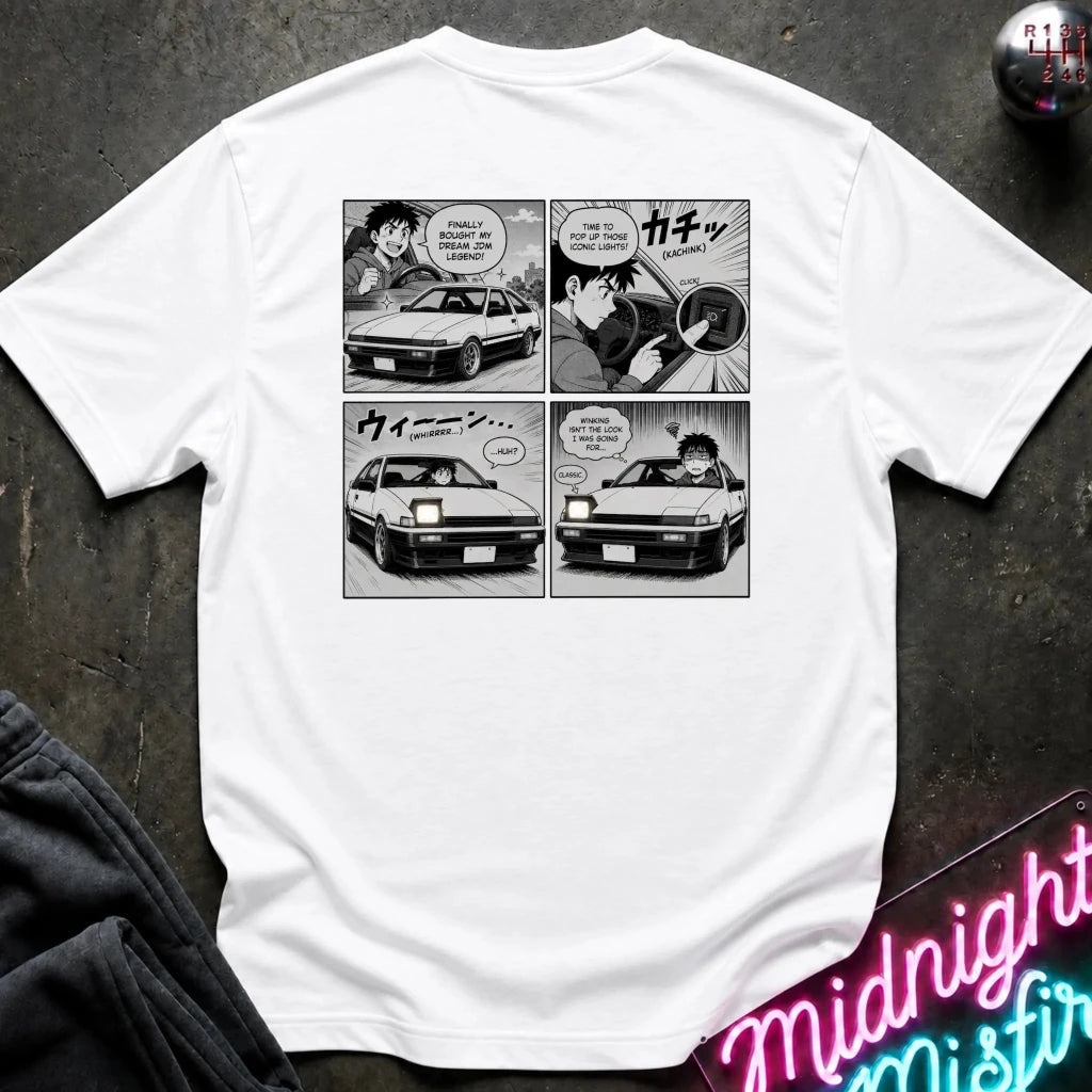 A white short-sleeve graphic t-shirt featuring a black and white manga comic print showing the headlight winking.