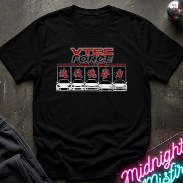 A black short-sleeve graphic t-shirt laid flat on a dark textured surface. The shirt features a red and white 'VTEC FORCE' logo above a row of five white sports cars with red Japanese characters.