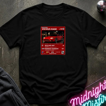 black crewneck t-shirt laid flat on a dark textured surface. The shirt features a red rectangular graphic print in the center with a red sports car 