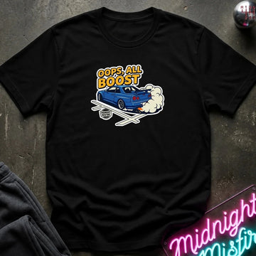 A black short-sleeve graphic t-shirt laid flat on a dark textured surface. The graphic features a blue car with white smoke and the text 'OOPS! ALL BOOST' in yellow and white.