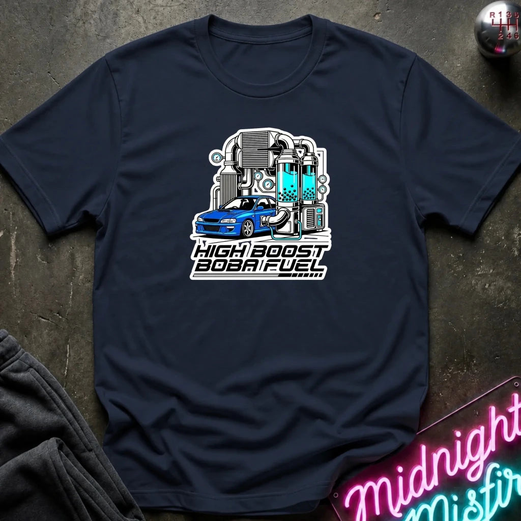 A navy blue short-sleeve t-shirt laid flat on a dark textured surface, featuring a graphic of a blue sports car with a high-speed exhaust system and the text 'HIGH BOOST BOB FUEL'.