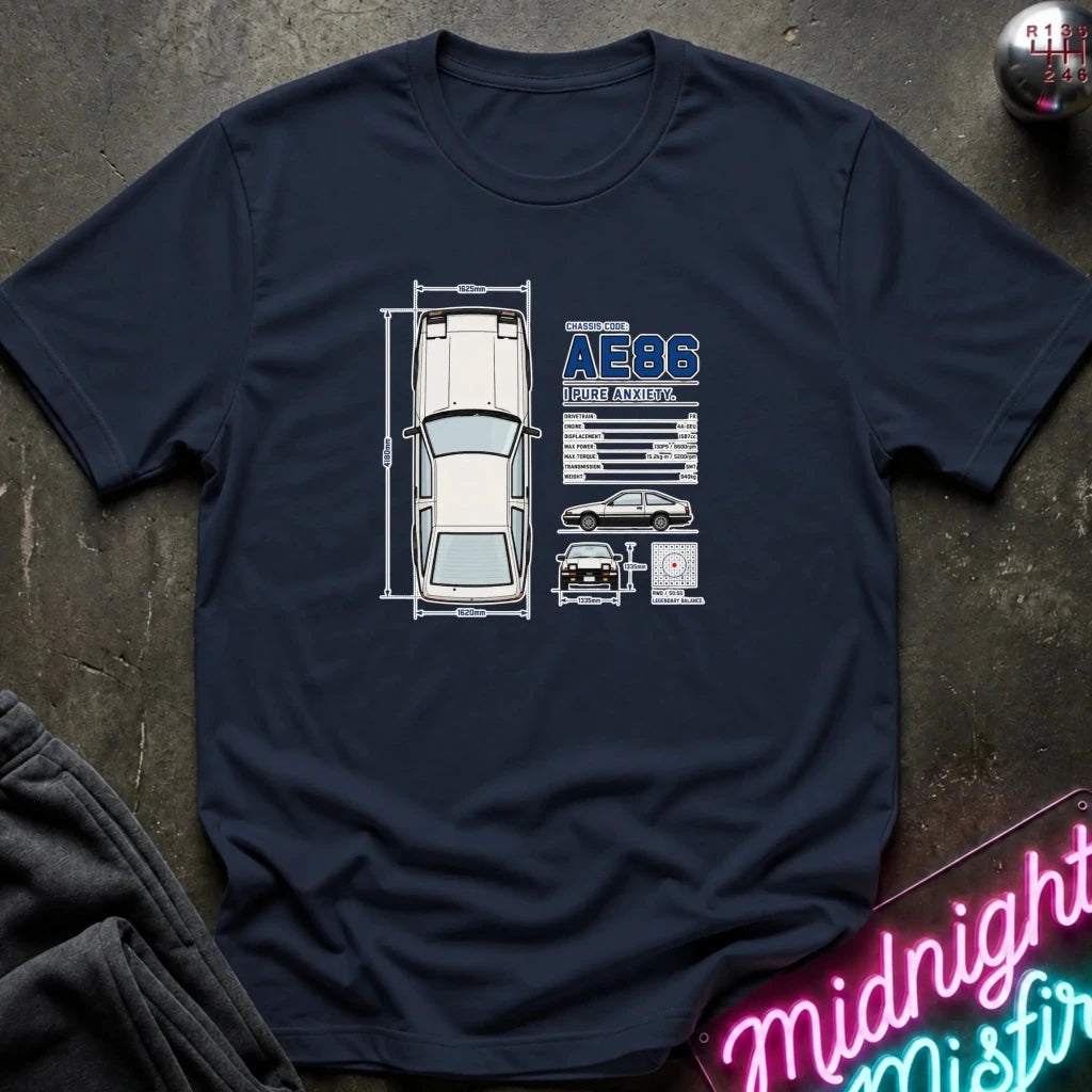 A navy blue crewneck t-shirt laid flat on a dark textured surface, featuring a graphic print of a white car schematic