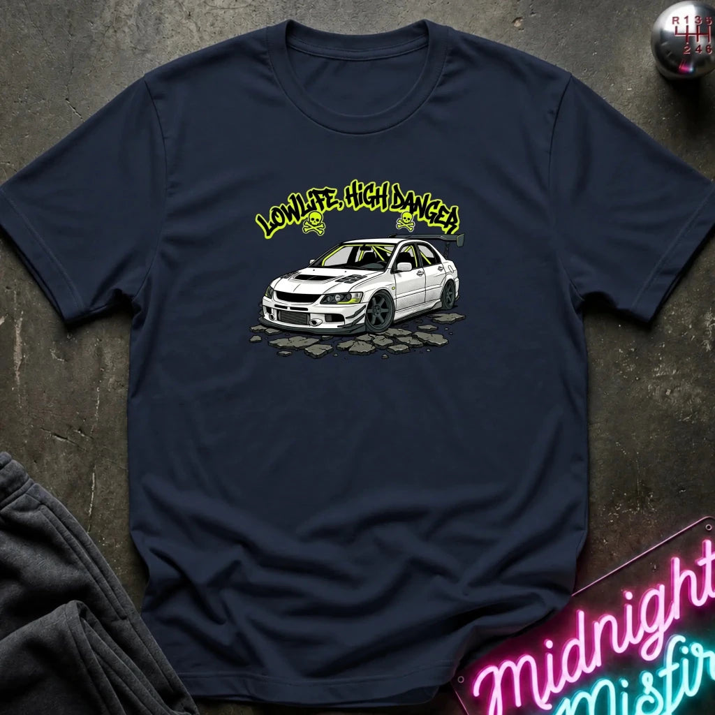 A navy blue short-sleeve crewneck t-shirt laid flat on a dark textured surface, featuring a vintage-style graphic print in the center with  a white car