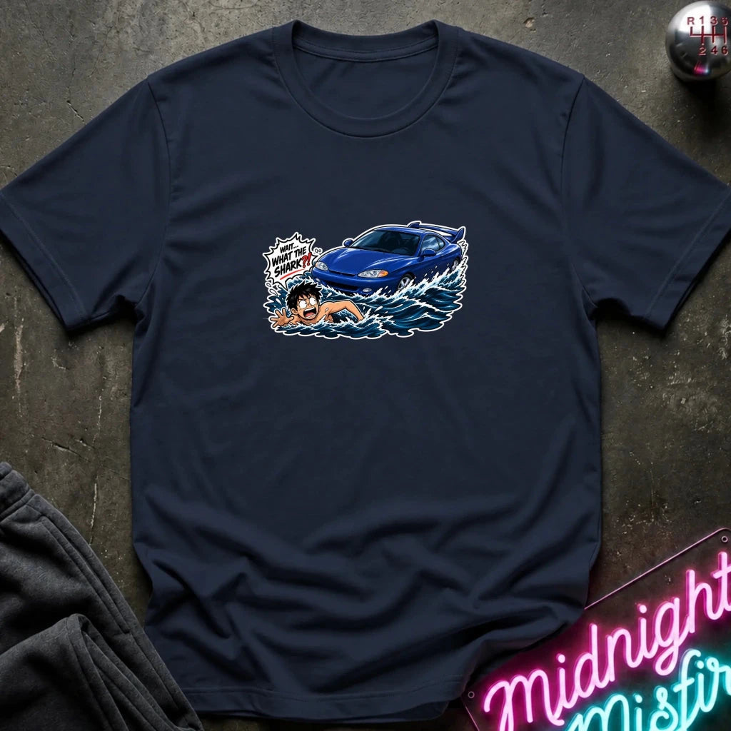 A navy short-sleeved t-shirt that has a blue car chasing a swimmer in open water.