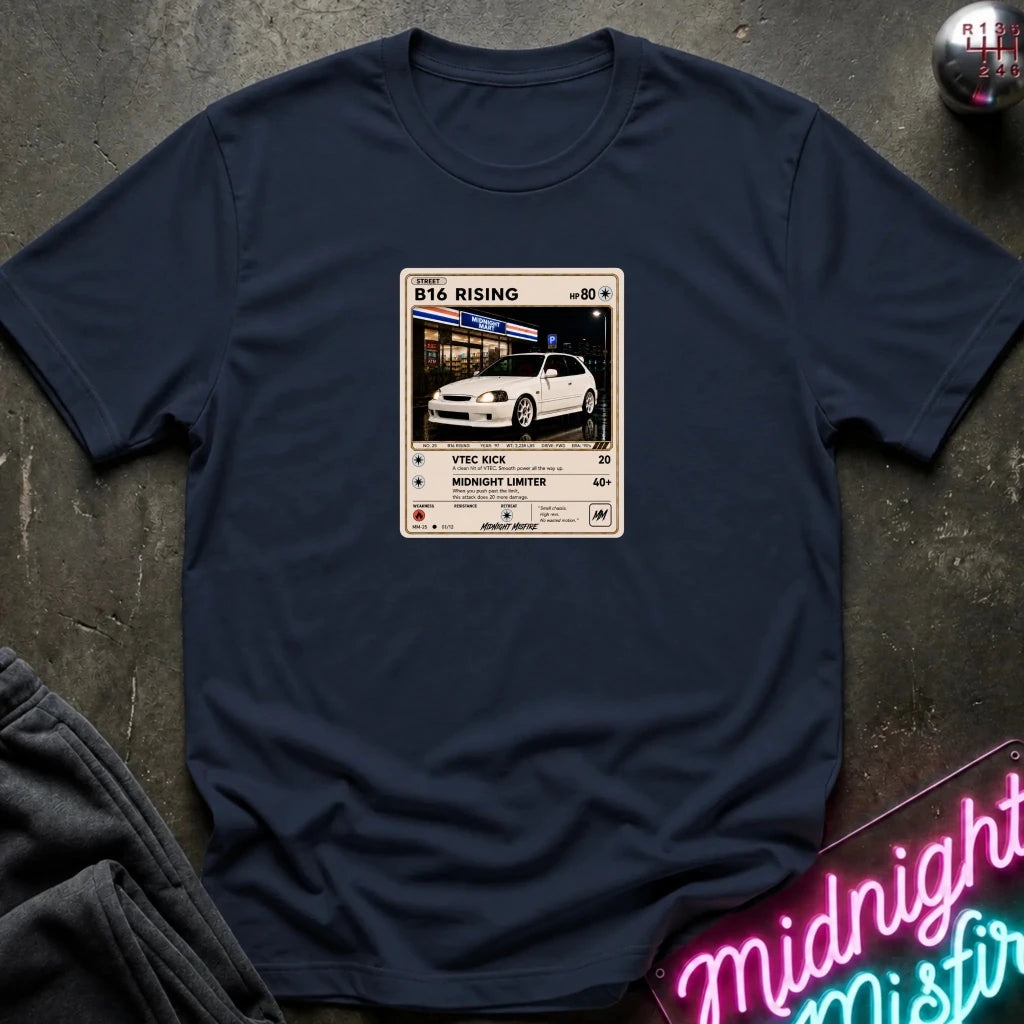 navy crewneck t-shirt laid flat on a dark textured surface, featuring a graphic print of vintage card and a car.