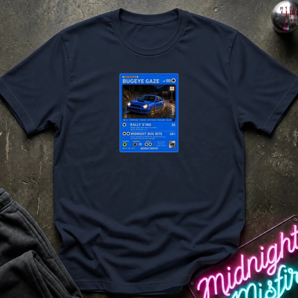 navy crewneck t-shirt laid flat on a dark textured surface, featuring a graphic print of vintage card and a car.
