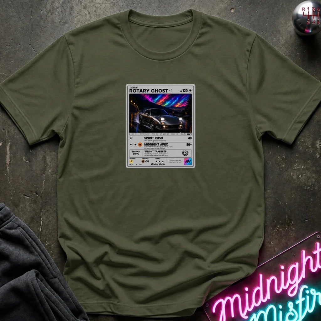 An olive crewneck t-shirt laid flat on a dark textured surface, featuring a graphic print of vintage card and a car.
