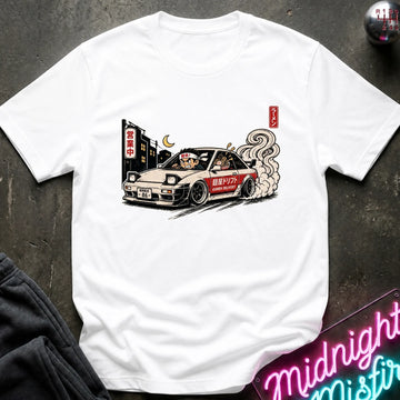 A white short-sleeve crewneck t-shirt featuring a graphic print of a beige and red drift car with smoke, displayed flat on a dark textured surface.