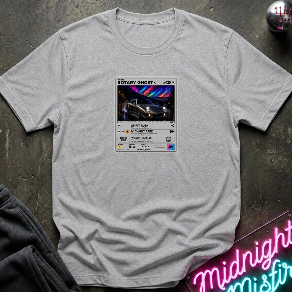 grey crewneck t-shirt laid flat on a dark textured surface, featuring a graphic print of vintage card and a car.