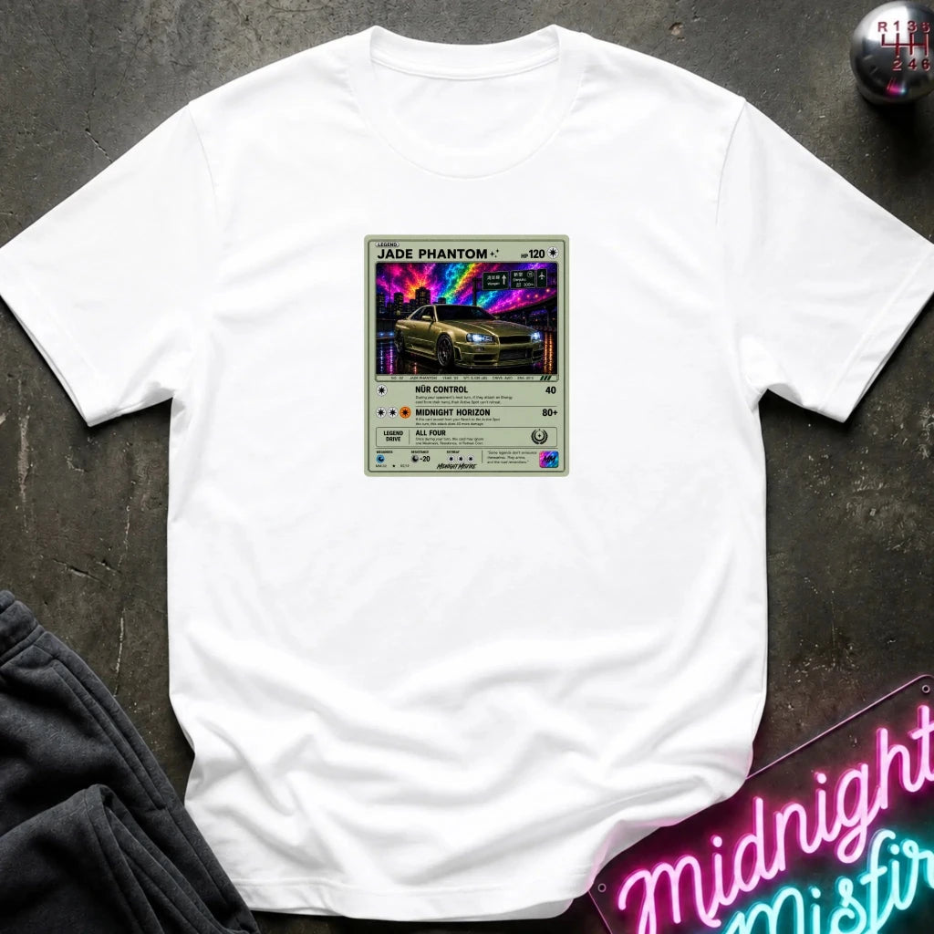 white crewneck t-shirt laid flat on a dark textured surface, featuring a graphic print of vintage card and a car.