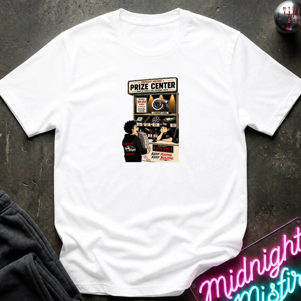 A white short-sleeve crewneck t-shirt laid flat on a dark textured surface, featuring a central graphic print of a prize center for car parts. 