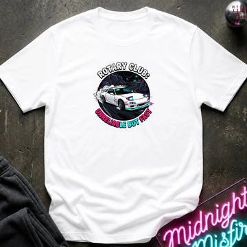white crewneck t-shirt laid flat on a dark textured surface. The shirt features a circular graphic print in the center showing a white sports car with blue and pink accents, surrounded by the text 'ROTARY CLUB!