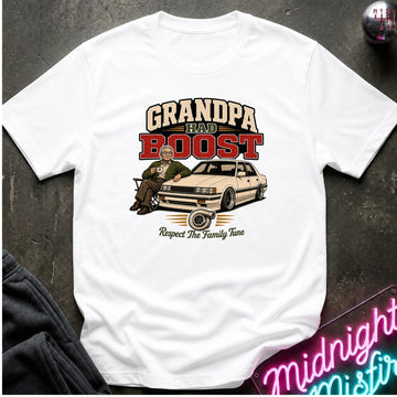 A white short-sleeve graphic t-shirt laid flat on a dark textured surface. The graphic features the text 'GRANDPA HAD BOOST' in beige and red, above an illustration of a man sitting on a beige car with the phrase 'Respect The Family Tune' below.