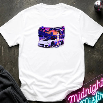 A white short-sleeve t-shirt laid flat on a dark textured surface, featuring a colorful graphic print of a white sports car and a woman in a neon-lit futuristic city scene. 