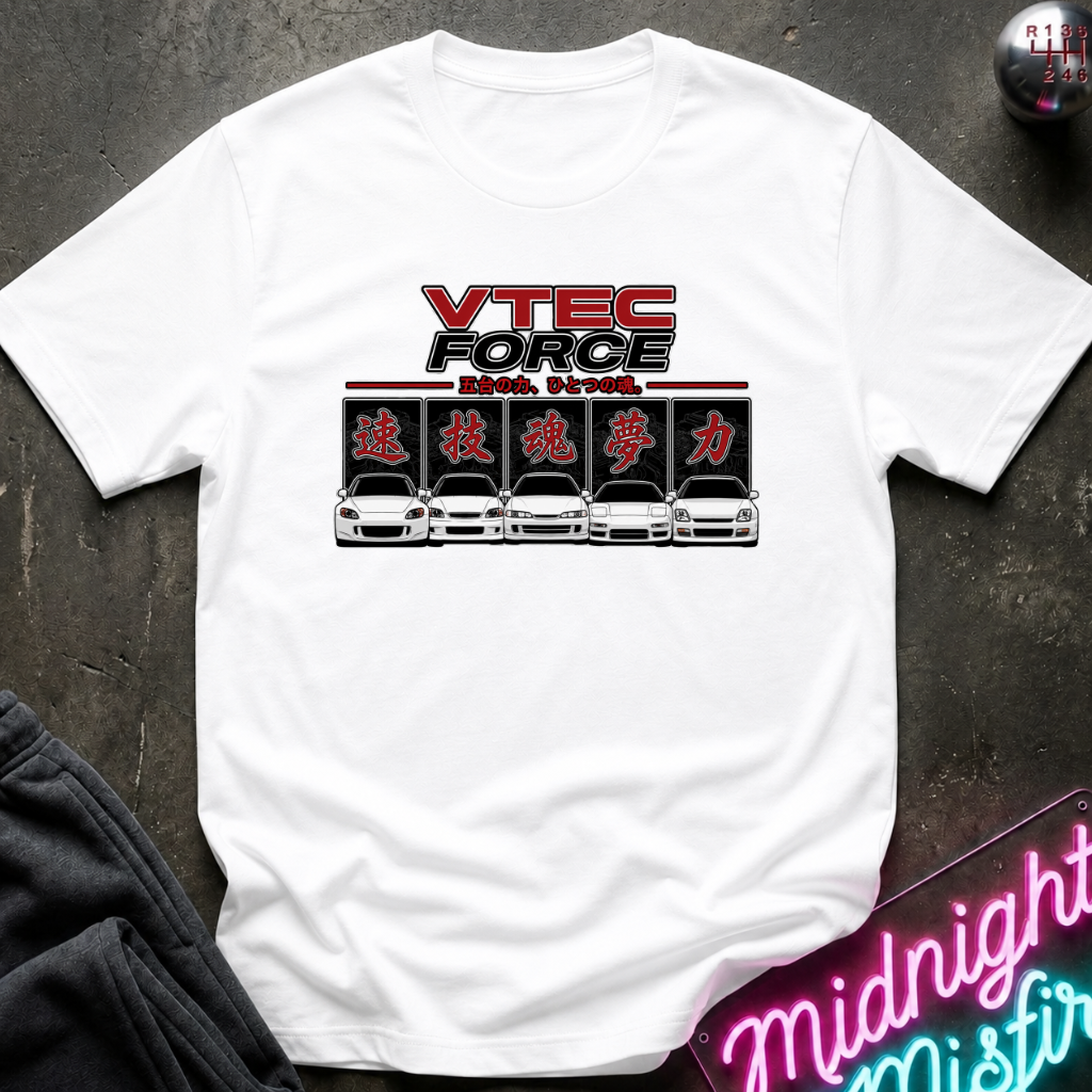 A white short-sleeve t-shirt with a 'VTEC FORCE' graphic printed on the chest, laid flat on a dark textured surface with a neon sign and sweatpants partially visible.