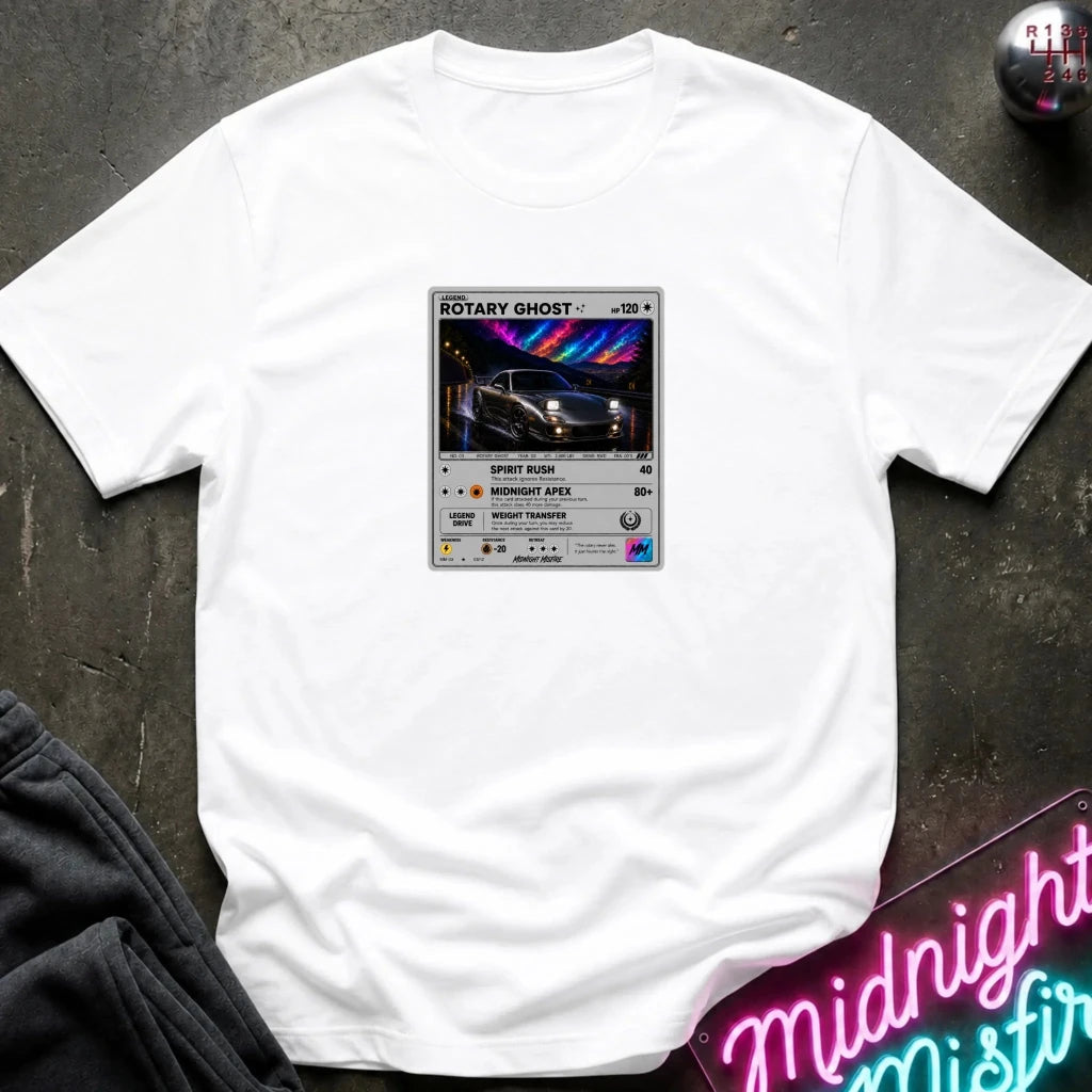 white crewneck t-shirt laid flat on a dark textured surface, featuring a graphic print of vintage card and a car.