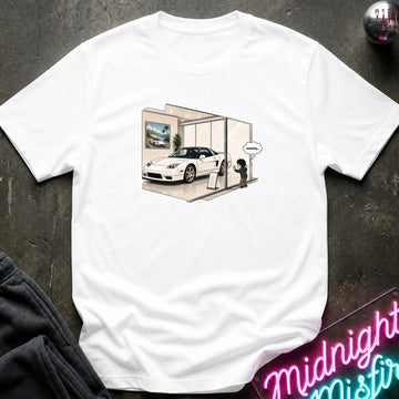 A white short-sleeve crewneck t-shirt with a graphic print of a white sports car inside a showroom, styled flat on a dark textured background with a neon sign and dark pants partially visible.