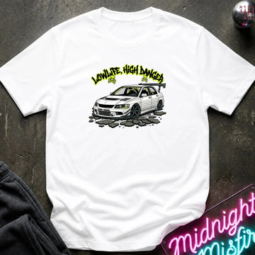 A white short-sleeve crewneck t-shirt laid flat on a dark textured surface, featuring a vintage-style graphic print in the center with  a white car