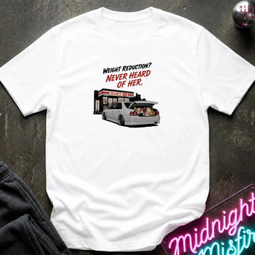 A white short-sleeve graphic t-shirt laid flat on a dark textured surface. The graphic features the text 'WEIGHT REDUCTION? NEVER HEARD OF HER.