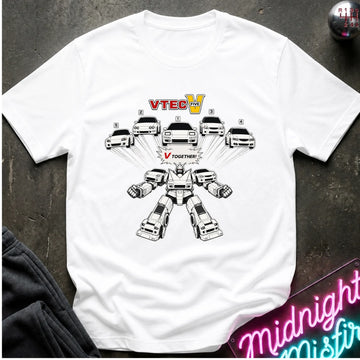 A white short-sleeve graphic T-shirt laid flat on a dark textured surface. The shirt features a black-and-white robot made from cars, with the text 'VTEC V' above and 'TOGETHER' below the robot.