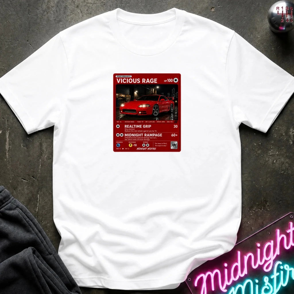 white crewneck t-shirt laid flat on a dark textured surface. The shirt features a red rectangular graphic print in the center with a red sports car 