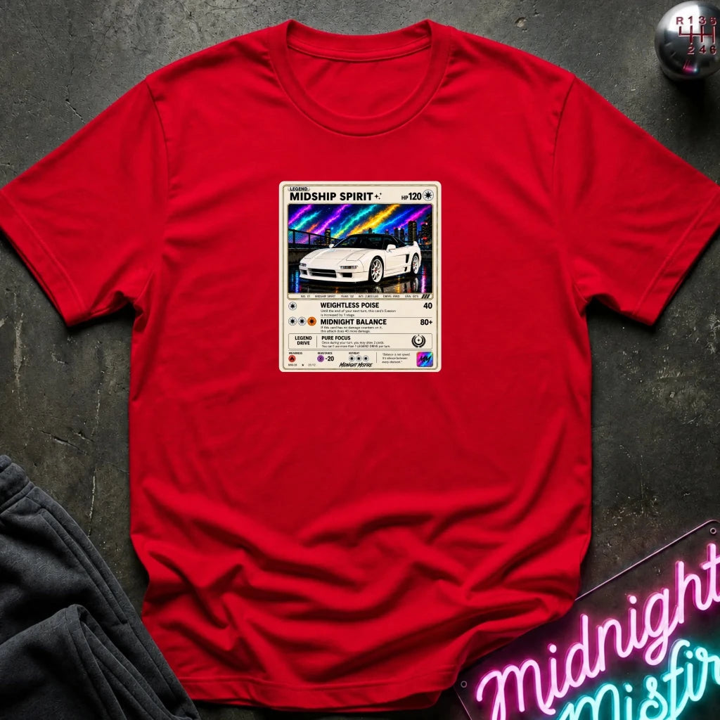 red crewneck t-shirt laid flat on a dark textured surface, featuring a graphic print of vintage card and a car.