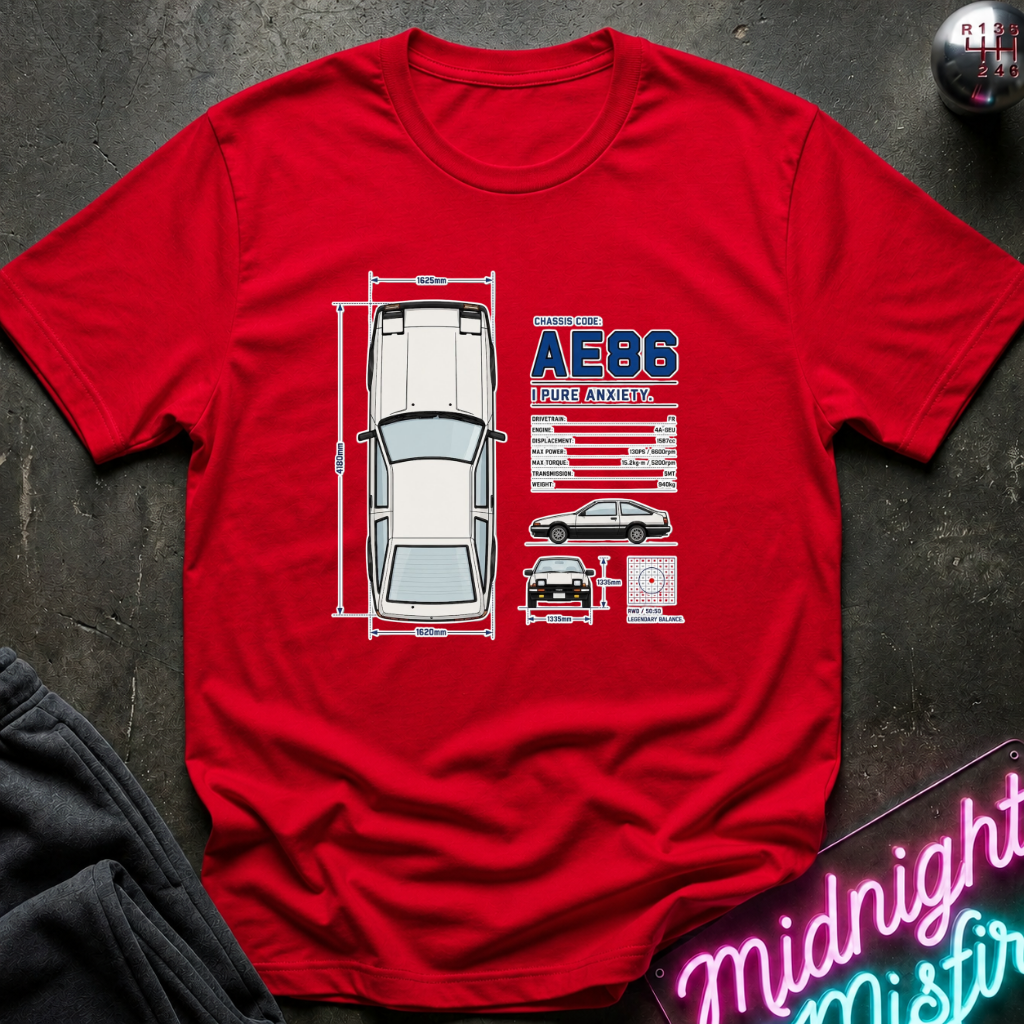 A red short-sleeve graphic t-shirt laid flat on a dark textured surface. The shirt features a white and blue print of a classic car with dimension lines, a car profile, and text.