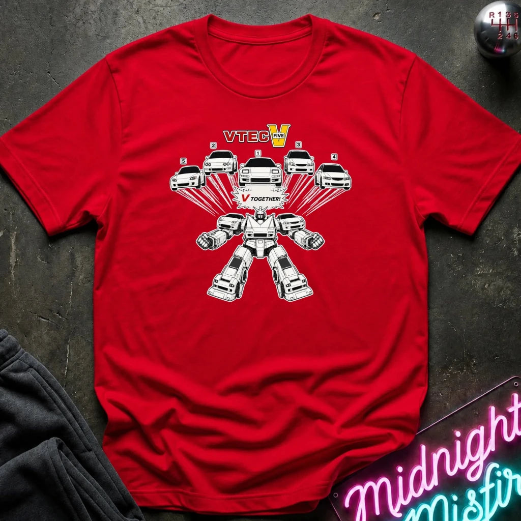 A red short-sleeve crewneck t-shirt laid flat on a dark textured surface. The shirt features a graphic of multiple white cars turn into robot