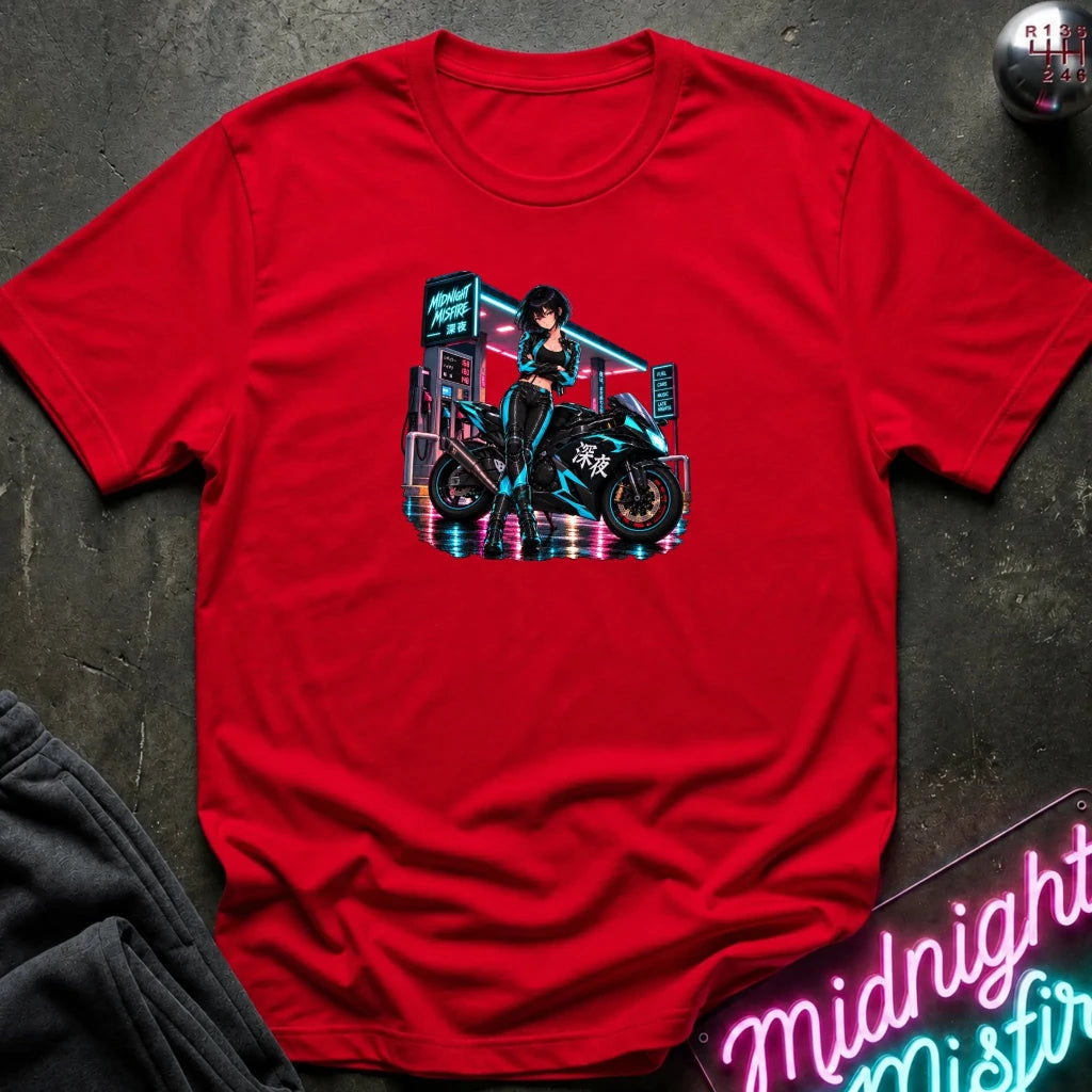 A red short-sleeve crewneck t-shirt featuring a colorful graphic of a woman in a black outfit riding a blue and black motorcycle in a neon-lit cyberpunk city scene. 