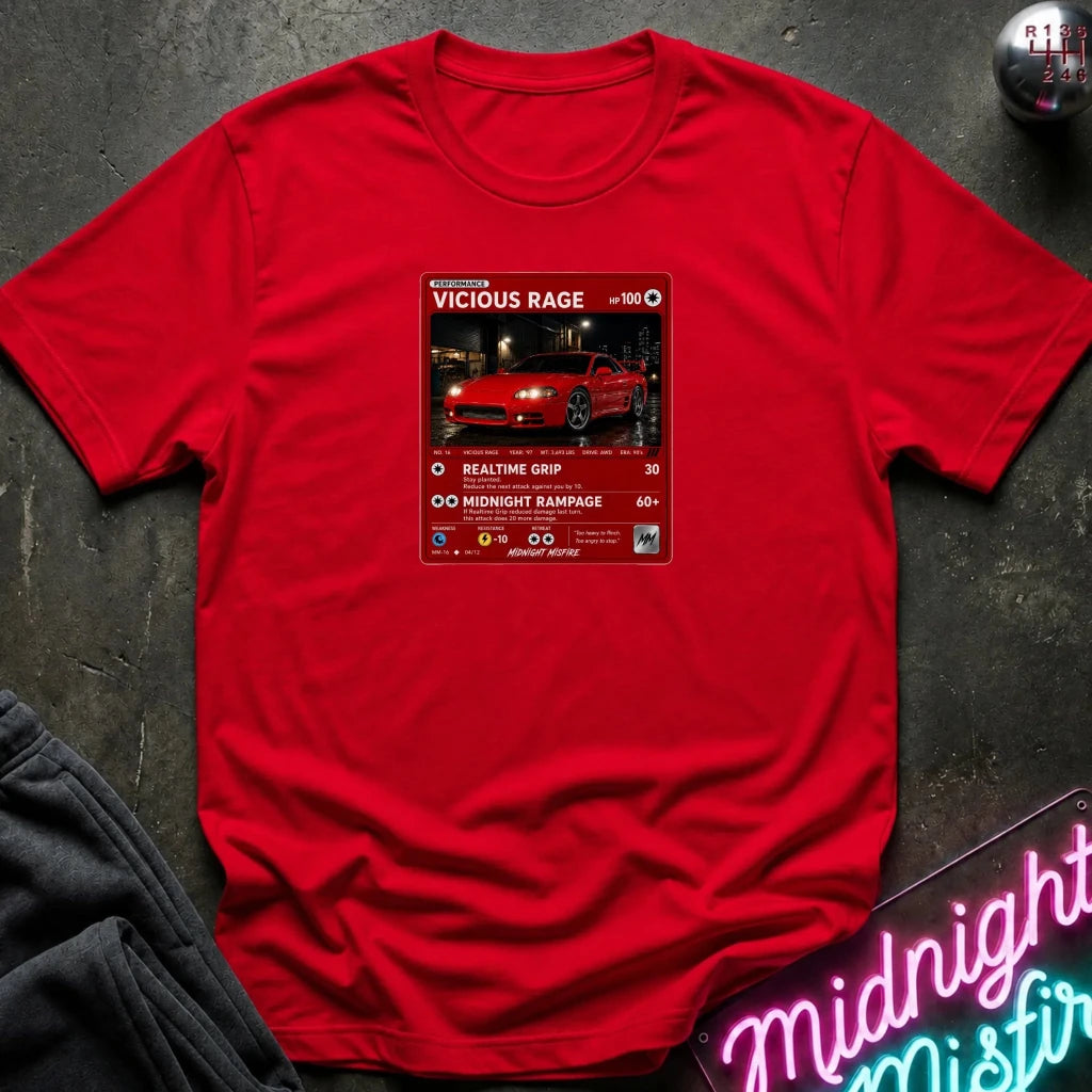 red crewneck t-shirt laid flat on a dark textured surface. The shirt features a red rectangular graphic print in the center with a red sports car 