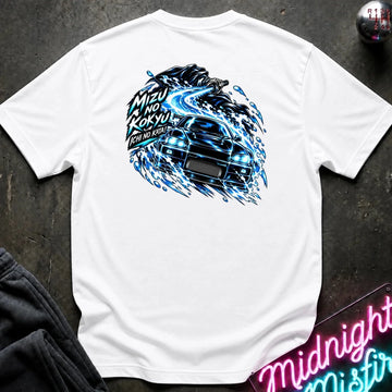 A white short-sleeve t-shirt laid flat on a dark textured surface, featuring a large back graphic of a black sports car surrounded by blue electric swirls and Japanese text. A neon sign and dark pants are partially visible as props.