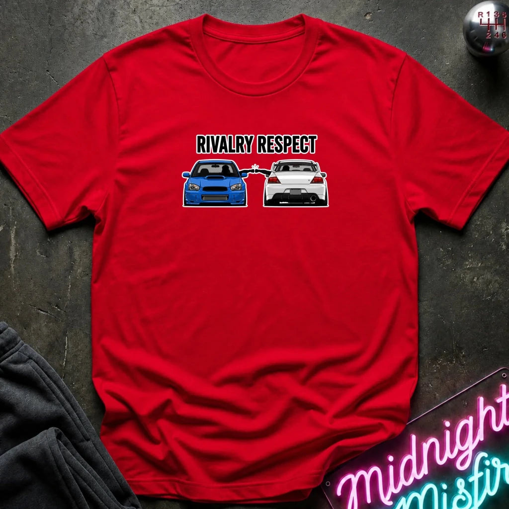red graphic t-shirt laid flat on a dark textured surface. The graphic features the text 'RIVALRY RESPECT' above a blue car facing a white car.