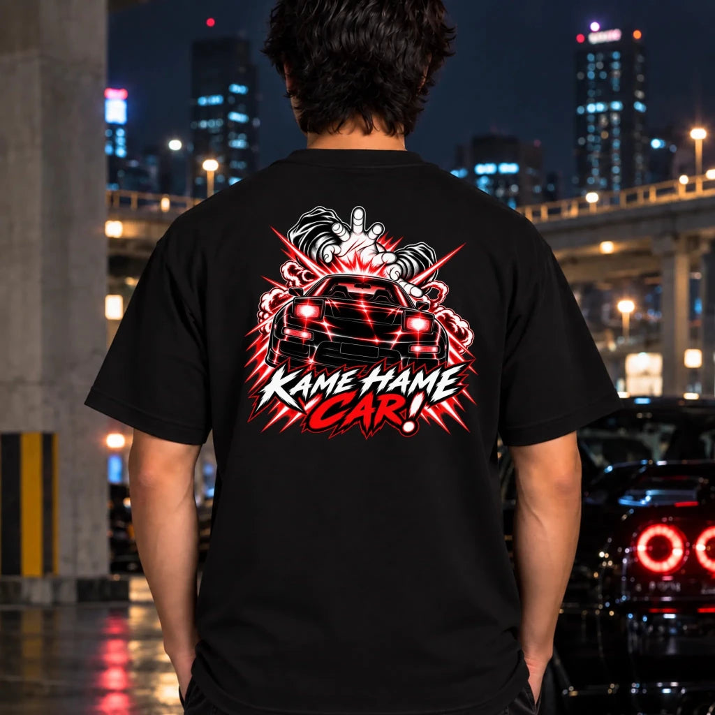 man wearing a black t-shirt featuring a large graphic print on the back of a black car with blue lightning effects and the text 'KAME HAME CAR!'.