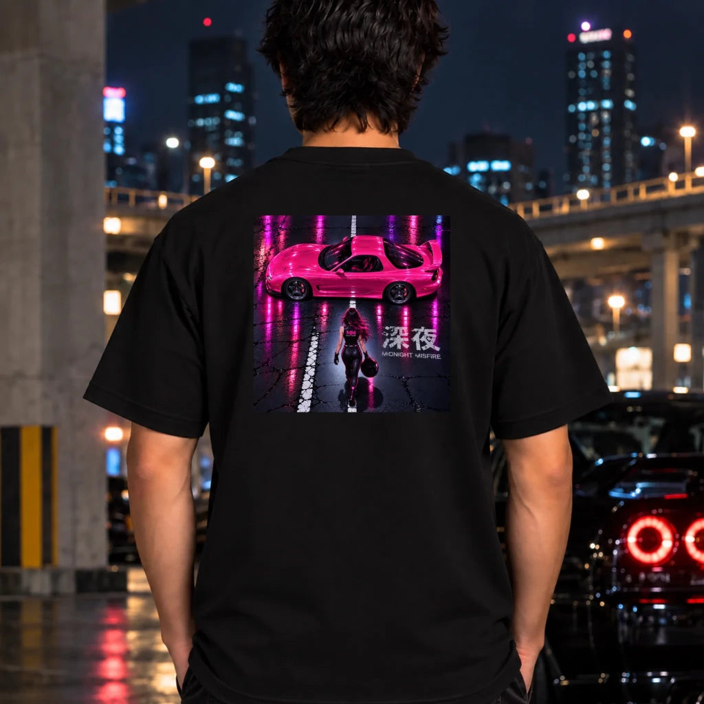 man wearing a black t-shit featuring a large rectangular graphic print on the back with a pink sports car and a woman walking under neon pink reflections.