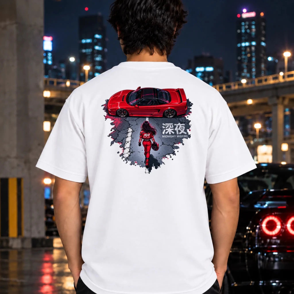 man wearing a white t-shirt featuring a graphic print on the chest depicting a red sports car and a person in a red outfit in snow.