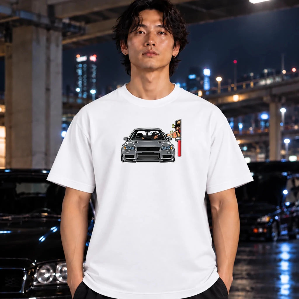 man on white t-shirt featuring a graphic print of a gray sports car and a vertical sign on the chest. 