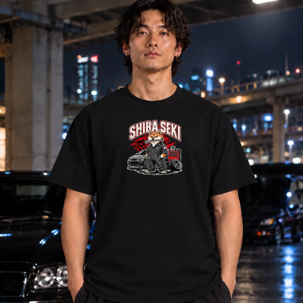 black  crewneck t-shirt featuring a graphic of a fox in a suit standing next to a car with the text 'SHIBA SEKI' above it, shirt is worn by a man under the bridge