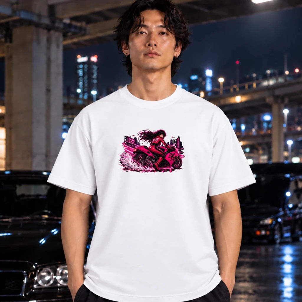 white short-sleeve t-shirt worn by a man, featuring a vibrant graphic of a woman riding a pink motorcycle with neon city lights.