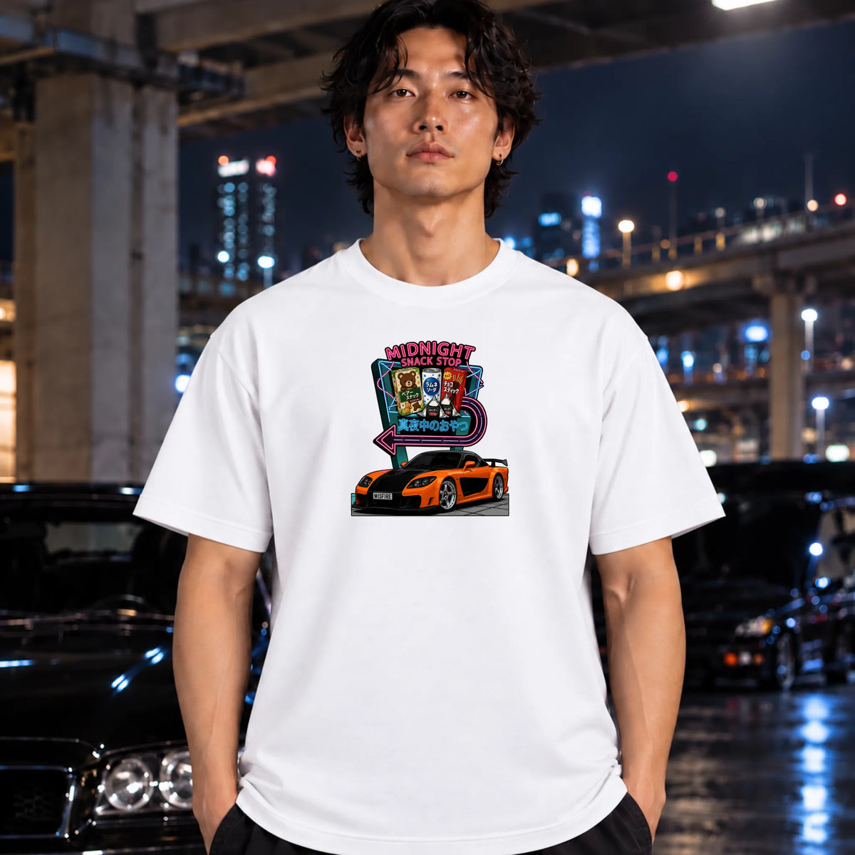 man wearing white tshirt  featuring a colorful graphic print of an orange sports car in front of a neon sign that reads 'Midnight Snack Stop'.