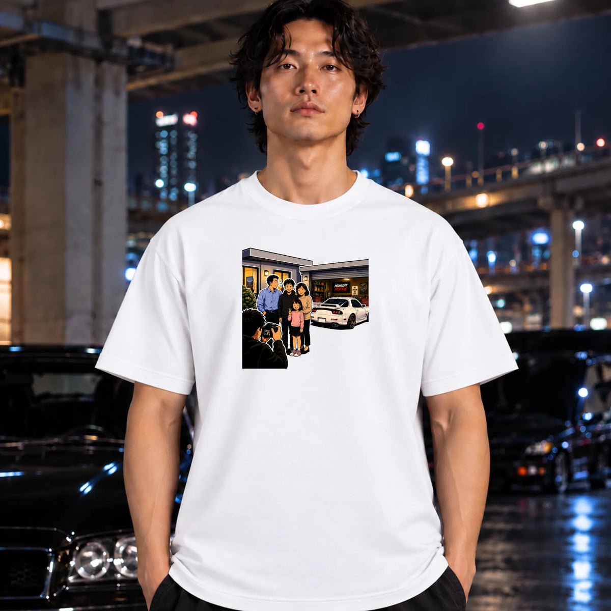man wearing a white t-shirt, featuring a rectangular graphic print of a family standing outside a building taking a photo.