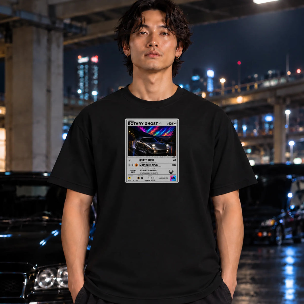 black crewneck t-shirt worn by a man, featuring a graphic print of vintage card and a car.