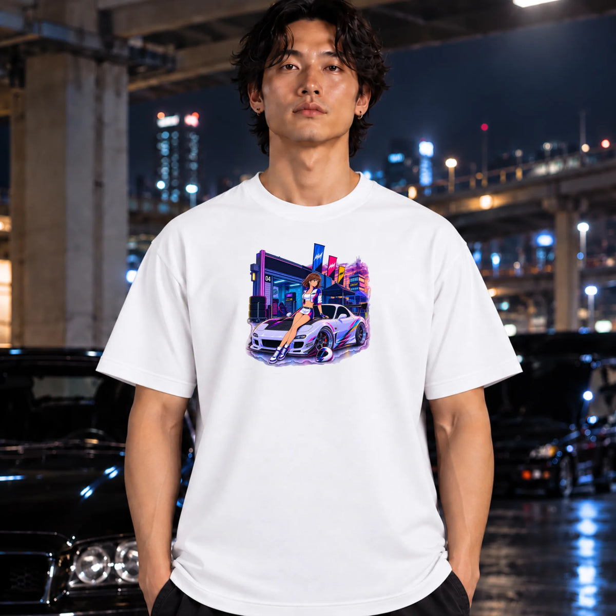 white t-shirt worn by a man, featuring a colorful graphic print of a white sports car and a woman in a neon-lit scene. 