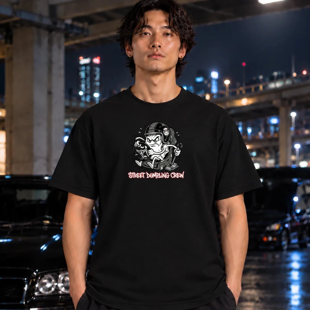 black crewneck t-shirt worn by a man. The shirt features a graphic of a street-dumper character with the text 'STREET DUMPING CREW' in red below.